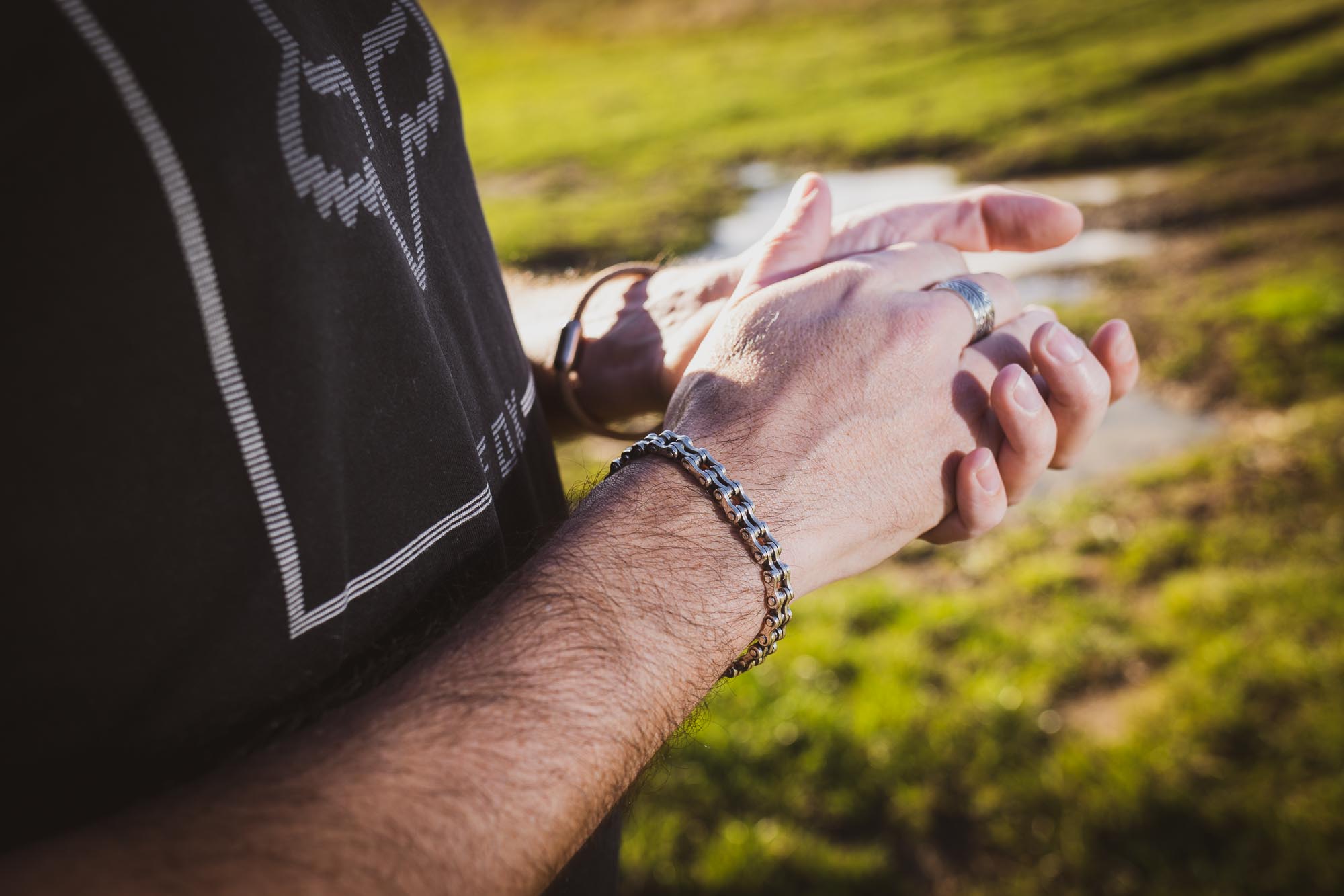 Cyclist wearing Cycolinks bike chain bracelet - lifestyle shot