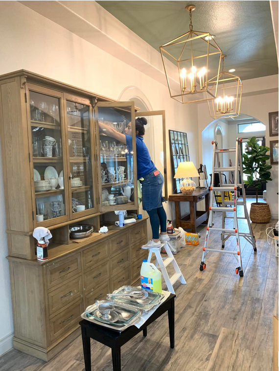 Post-renovation cleaning specialist in Toronto & Scarborough restoring display cabinet – Just Clean It team